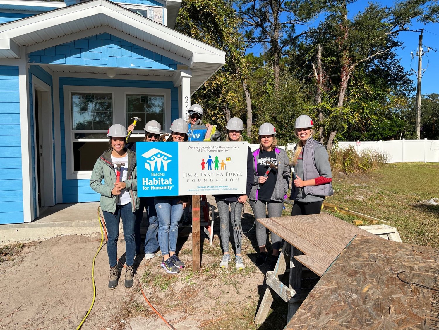 PGA TOUR employees help with the construction of a home for a family partnering with Beaches Habitat for Humanity.